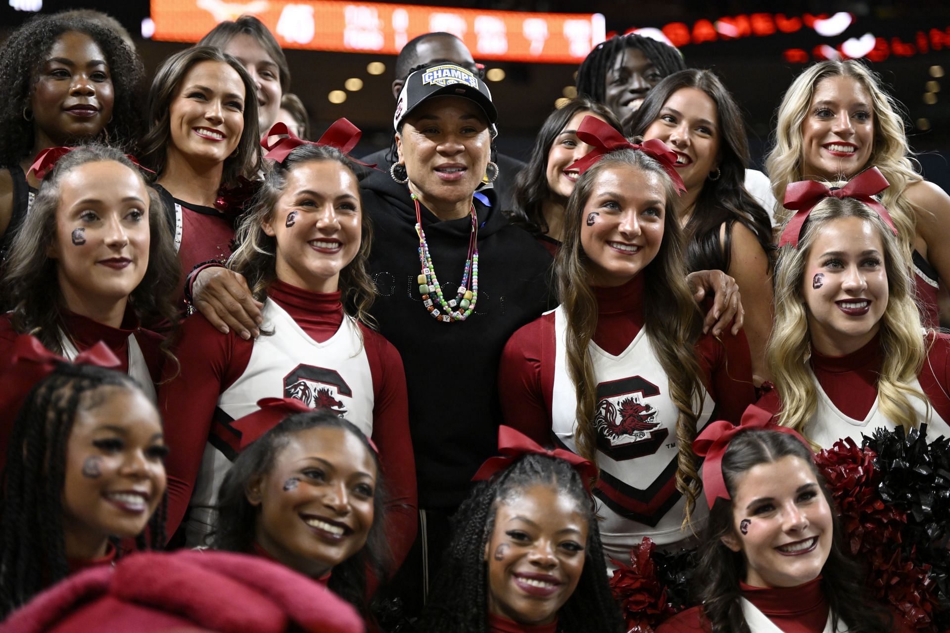 Head coach Dawn Staley of the South Carolina Gamecocks poses for a photo with the cheer team after their win over the Texas Longhorns in the SEC Tournament championship game. Photo: Getty