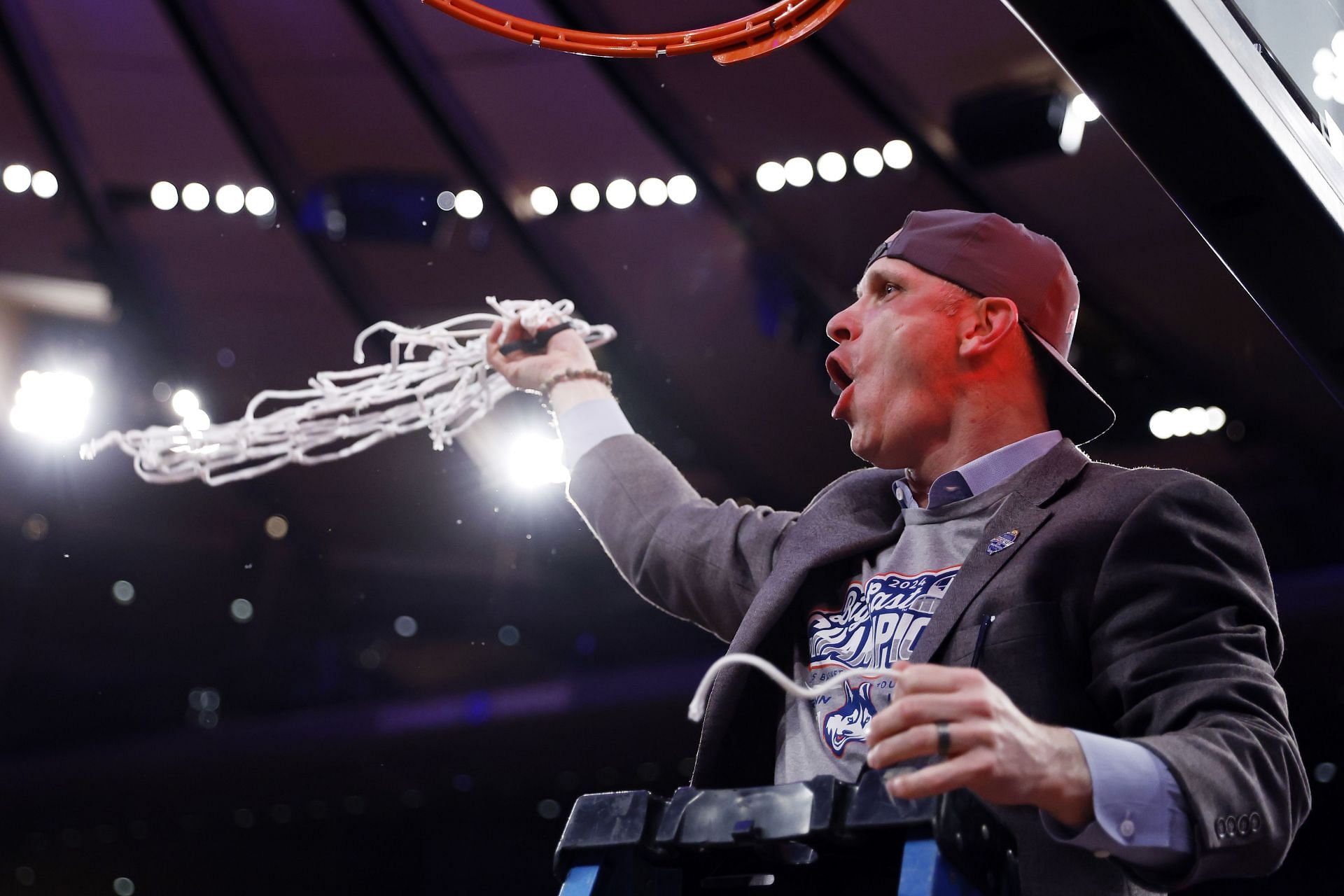 Head coach Dan Hurley of the Connecticut Huskies cuts a piece of the net after winning the game against the Marquette Golden Eagles during the Big East Basketball Tournament Final at Madison Square Garden on March 16, 2024 in New York City. Photo: Getty