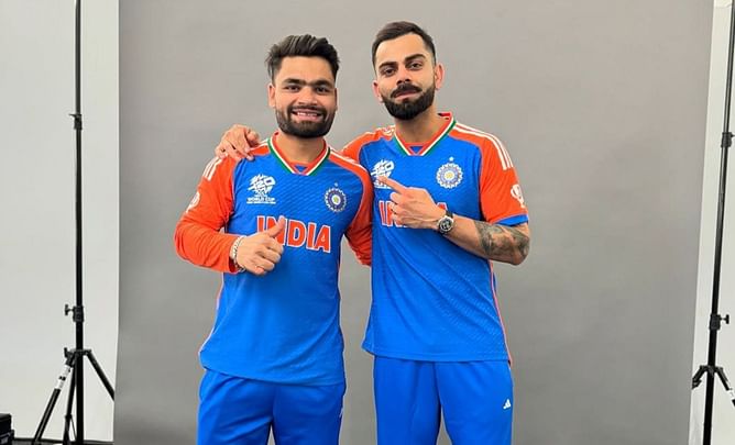 Virat Kohli poses with Rinku Singh and Harshit Rana ahead of IPL 2025 opener
