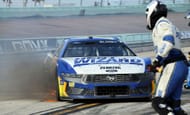 Ryan Blaney (#12 Team Penske Dent Wizard Ford) pits while on fire after blowing his engine in late race action during the NASCAR Cup Series Straight Talk Wireless 400 - Source: Getty