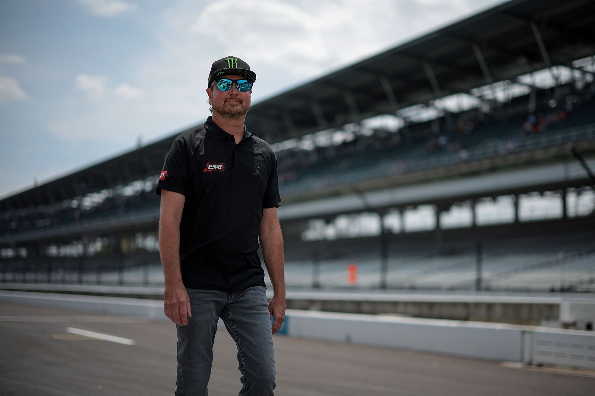 Advisor to 23XI Racing, Kurt Busch walks the grid during qualifying for Brickyard 400 - Source: Getty