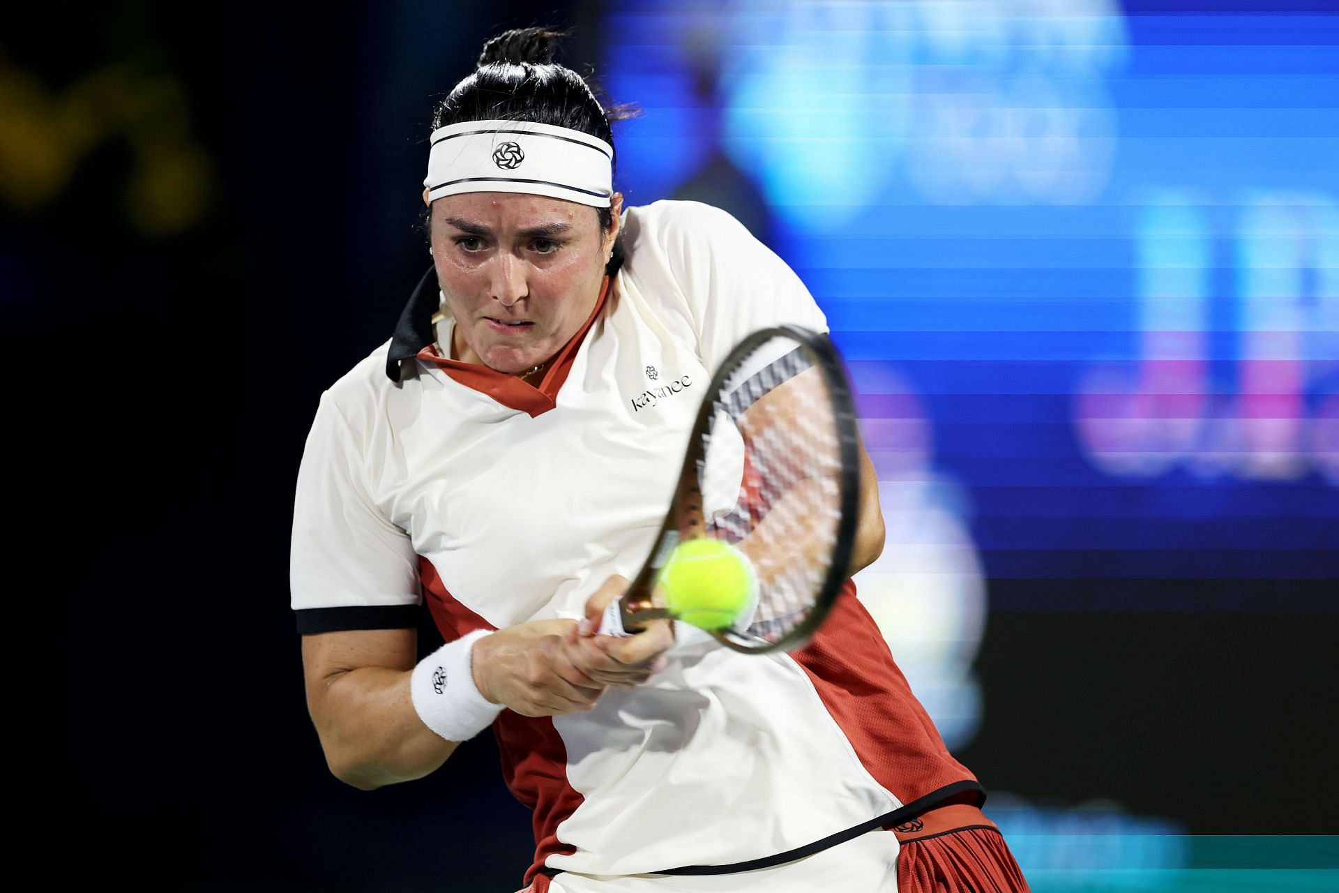 Ons Jabeur of Tunisia plays a backhand against Peyton Stearns of the United States in their first round match during day two of the Dubai Duty Free Tennis Championships - Source: Getty