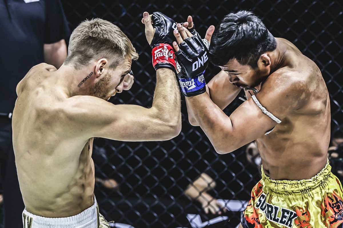 Superlek (right) lands an elbow on Jonathan Haggerty [Photo via ONE Championship]