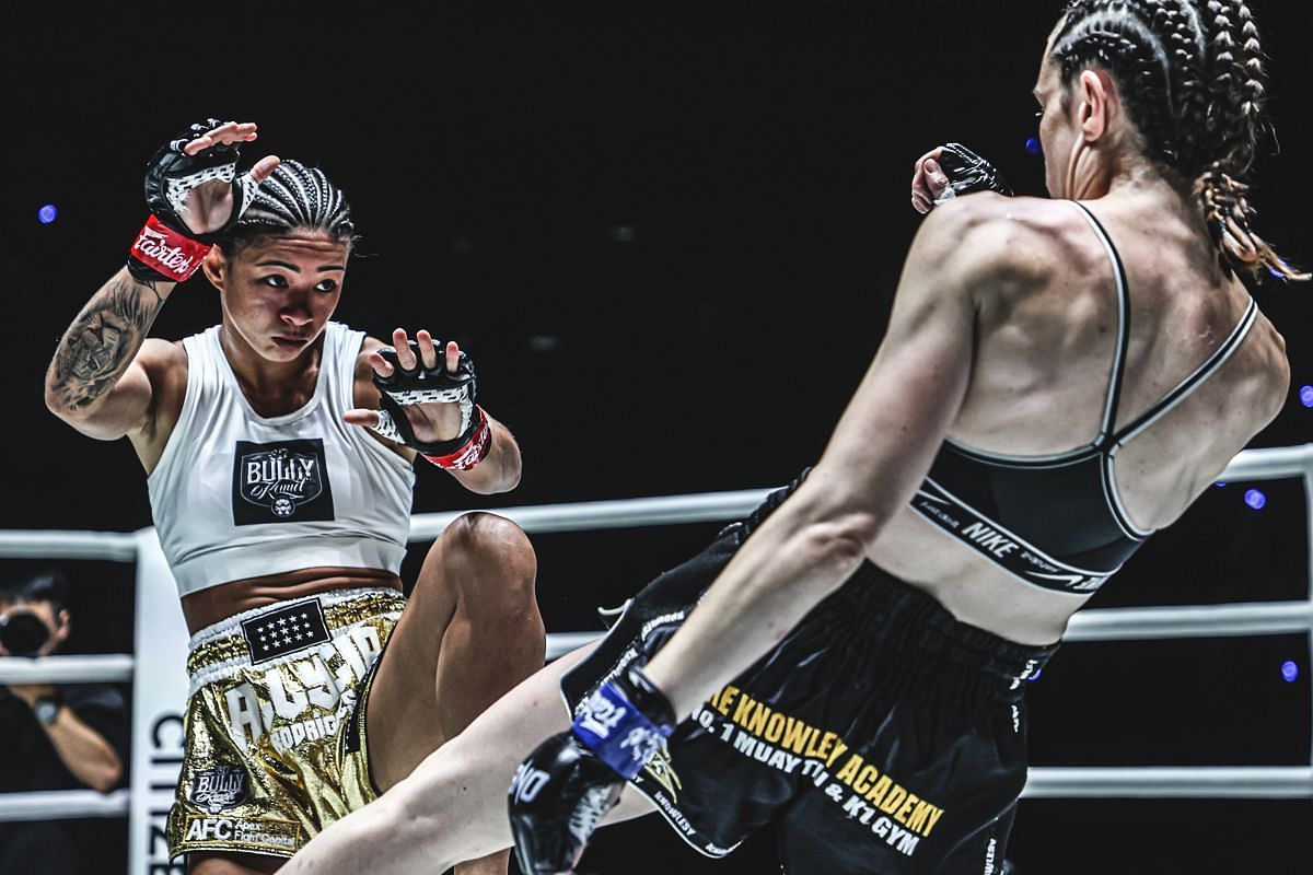 (From left) Allycia Hellen Rodrigues and Marie McManamon trade strikes at ONE Fight Night 29.