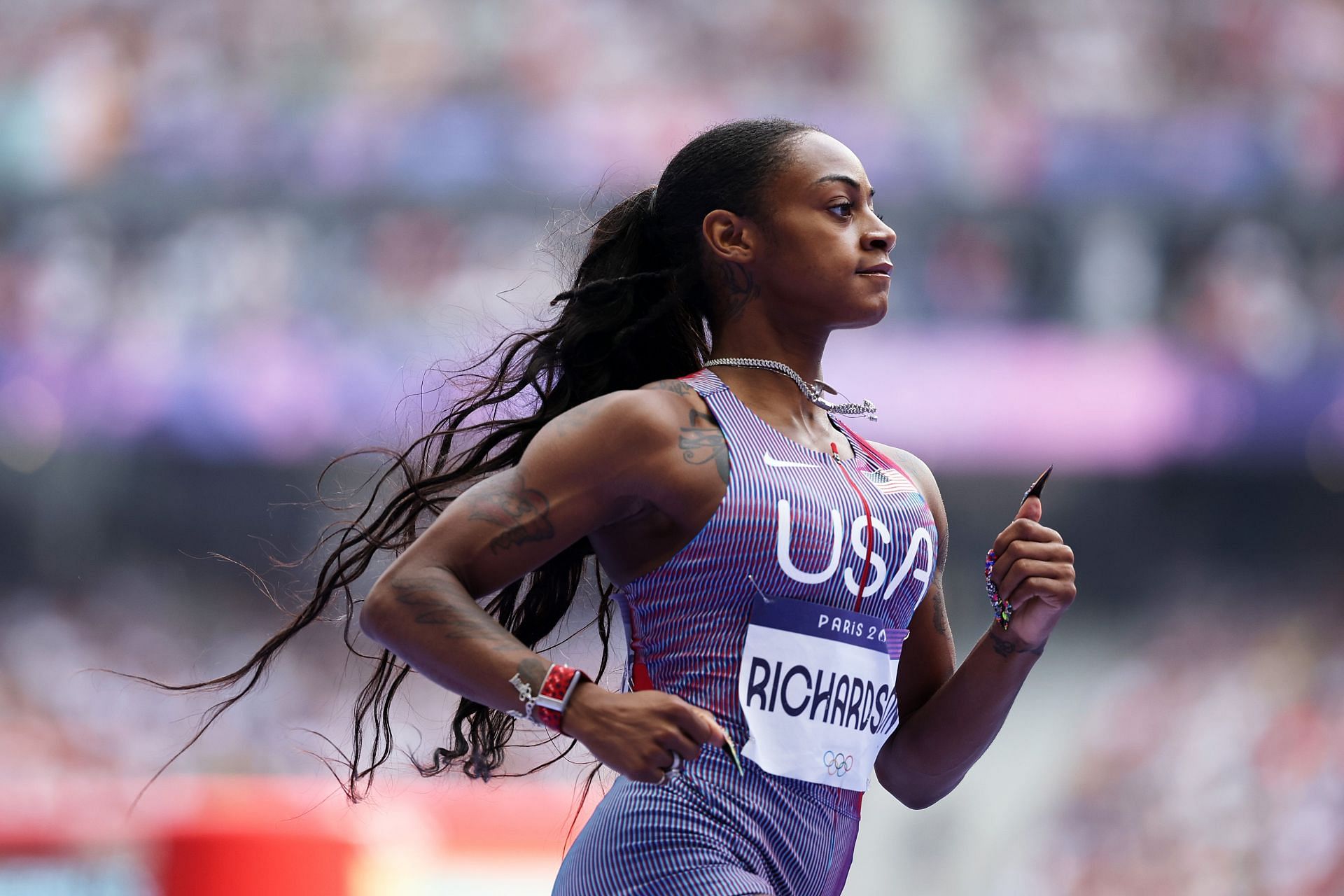 Richardson running the heats of the 100m event on the seventh day of the 2024 Paris Olympics (Image via: Getty Images)