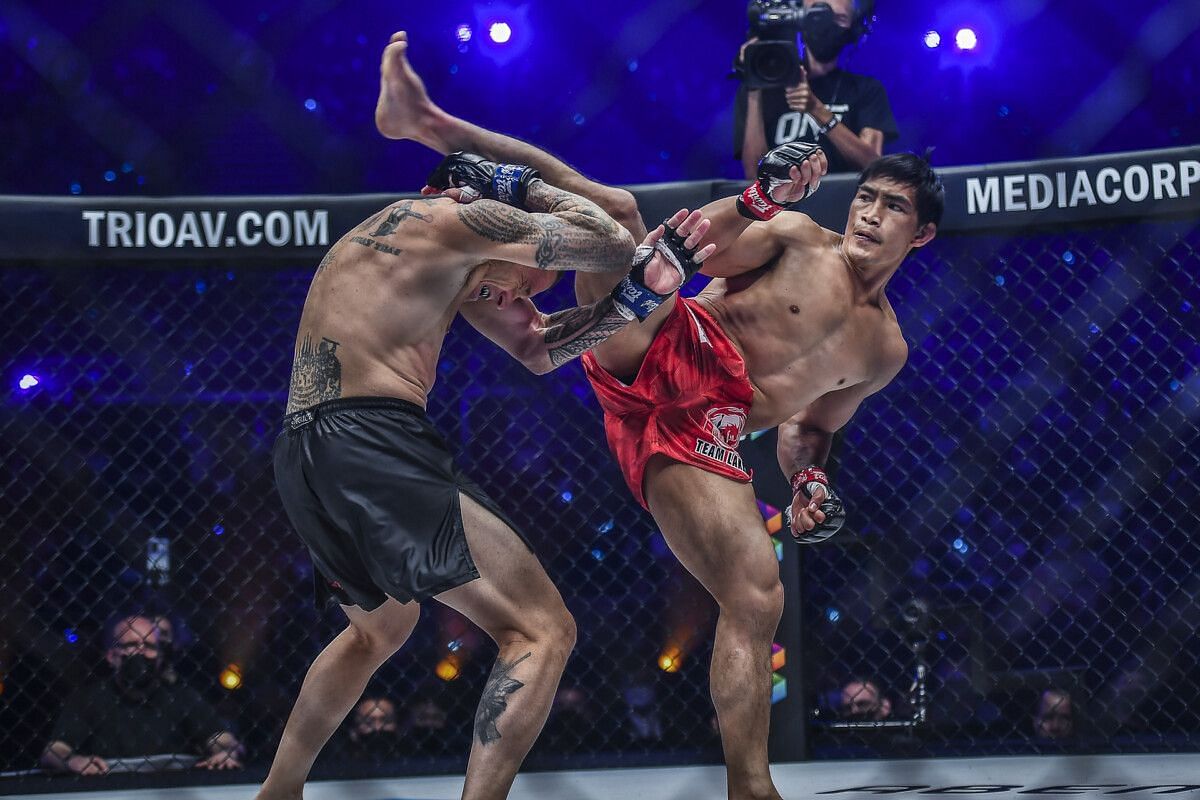 Eduard Folayang (right) lands a spinning back kick on John Wayne Parr