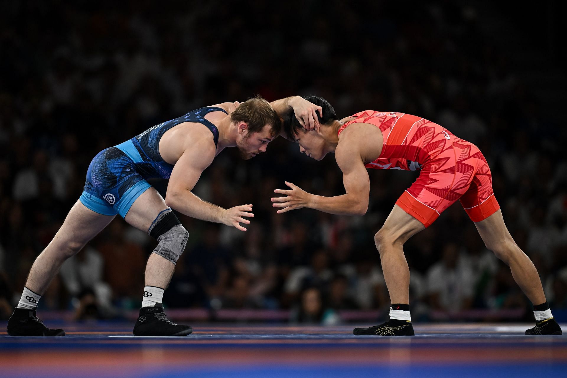 Spencer Lee in action during the Paris Olympics finals against Rei Higuchi of Japan [Image Source: Getty]