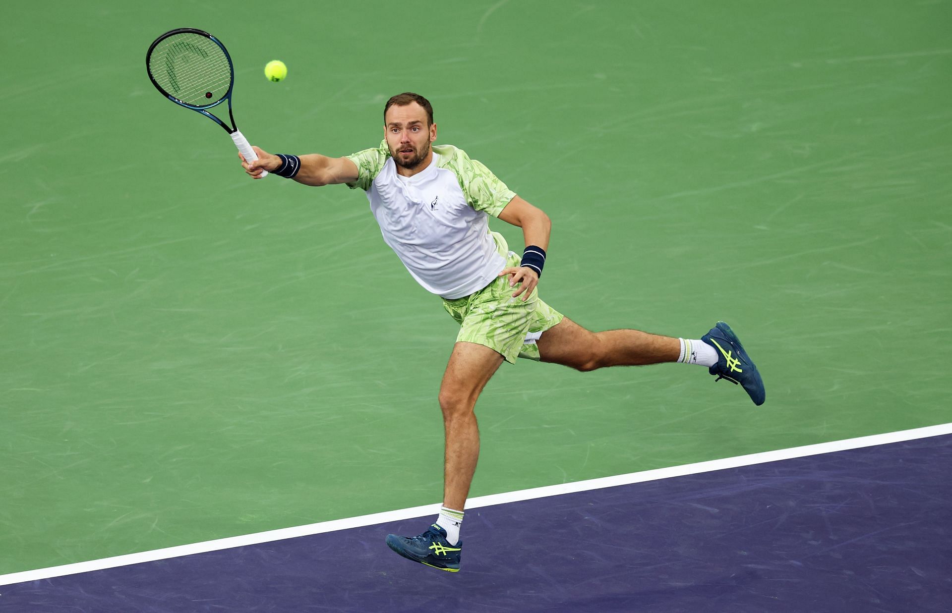 Roman Safiullin plays a forehand against Reilly Opelka of the United States in their first round match during the BNP Paribas Open at Indian Wells - Source: Getty