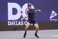 Jenson Brooksby of the United States plays a shot against Tommy Paul of the United States during their Men's Singles Round of 32 match on day two of the 2025 Dallas Open - Source: Getty