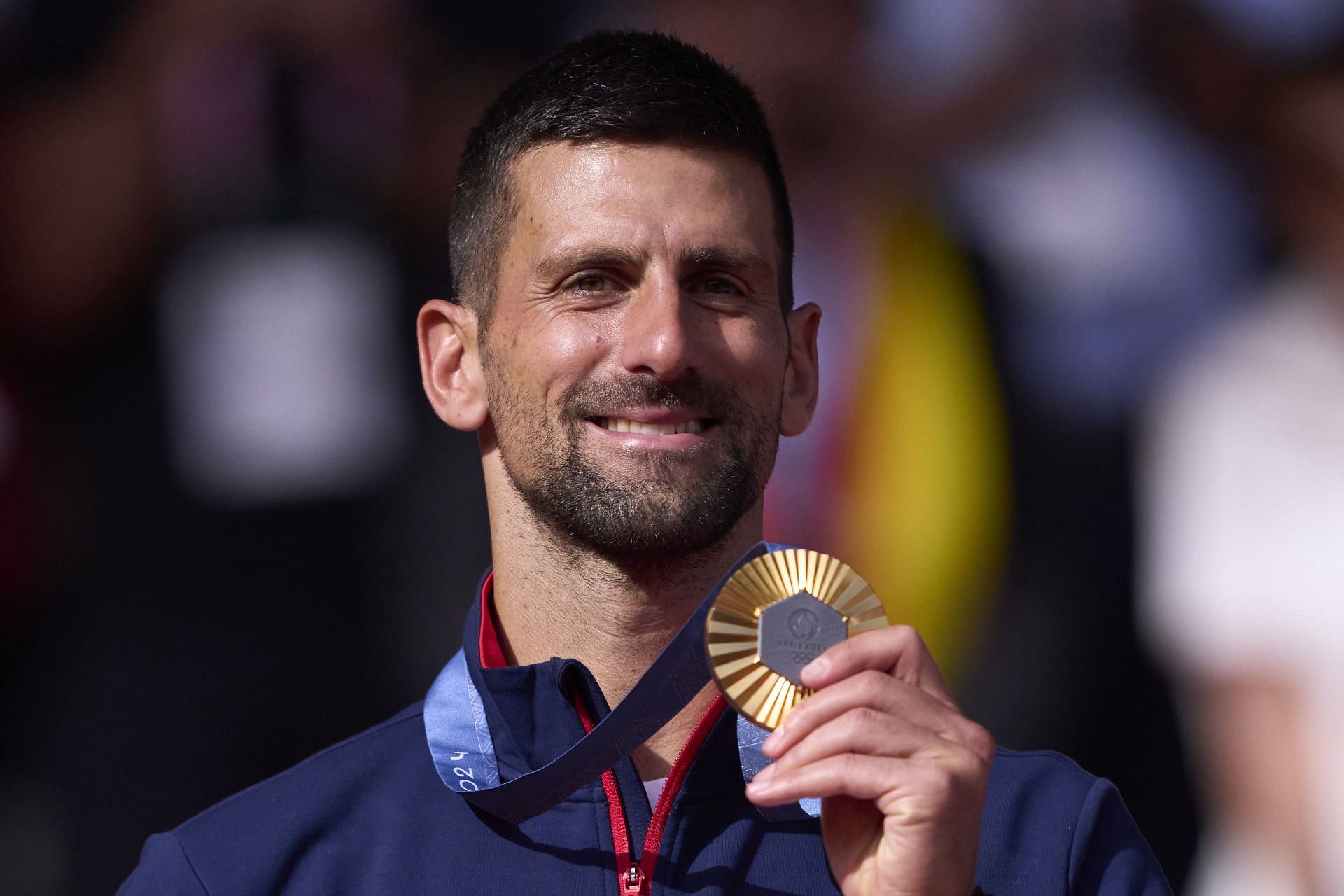 Novak Djokovic holding his Gold medal - Source: Getty