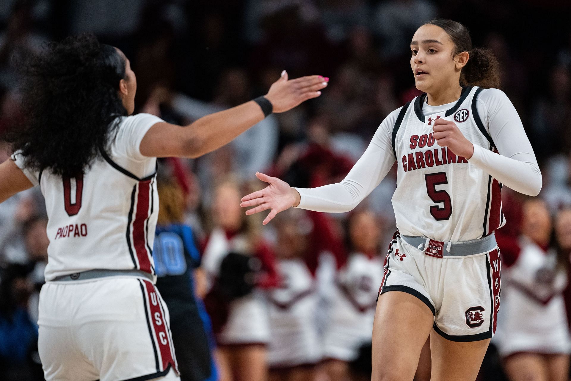 Te-Hina Paopao (#0) of the South Carolina Gamecocks celebrates with Tessa Johnson (#5) in the first half of their game against the Kentucky Wildcats at Colonial Life Arena on March 02, 2025 in Columbia, South Carolina. Photo: Getty