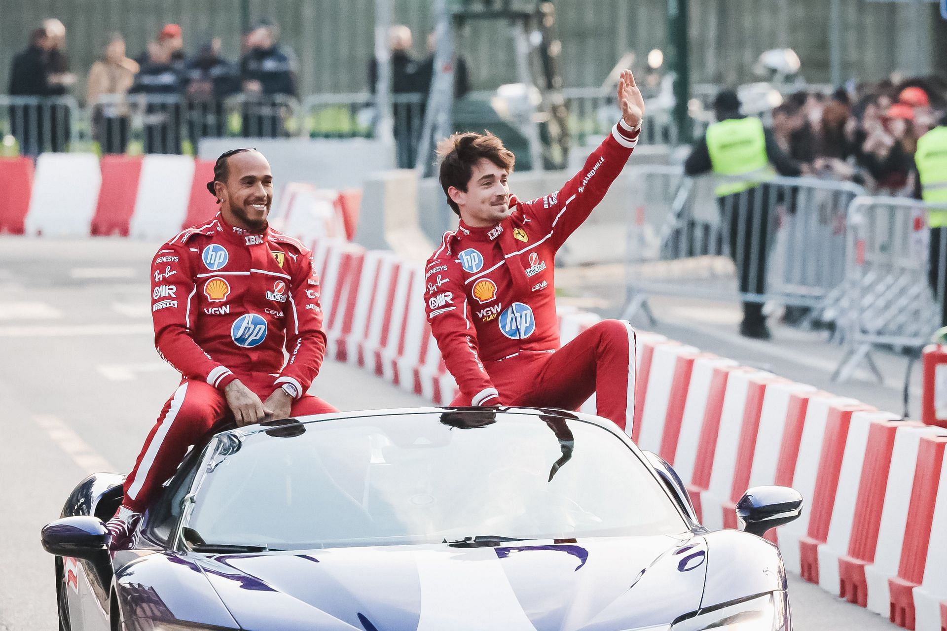 The Scuderia Ferrari HP drivers Lewis Hamilton and Charles Leclerc during a street demo in the City Circuit in Milan - Source: Getty