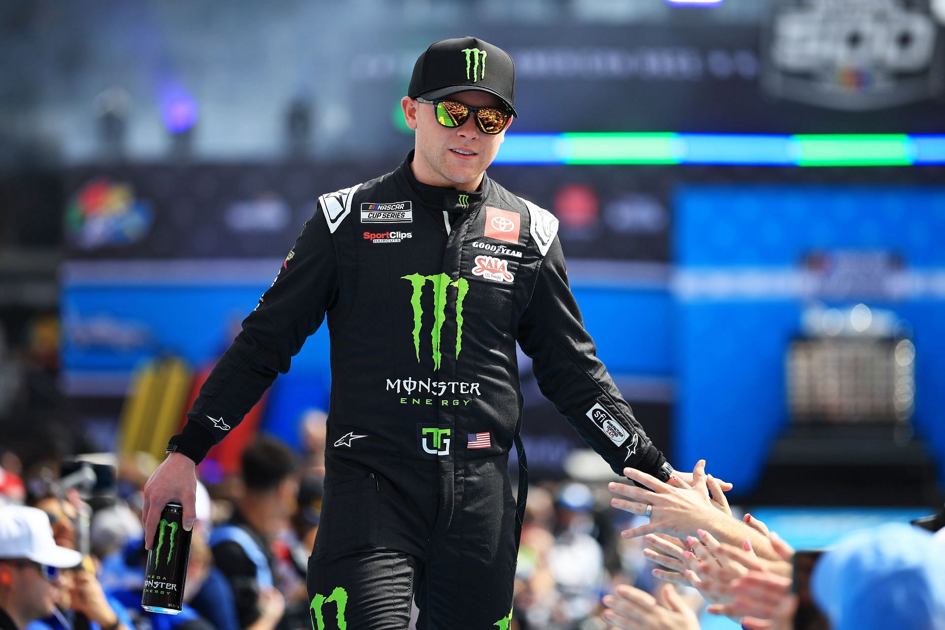 Ty Gibbs greets fans as he walks onstage during driver intros prior to the NASCAR Cup Series Daytona 500 - Source: Getty