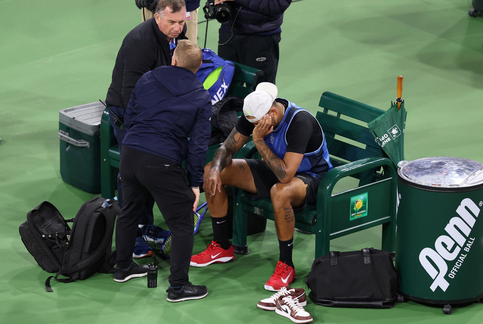 Nick Kyrgios receives medical attention for his wrist injury at the BNP Paribas Open. Source: Getty