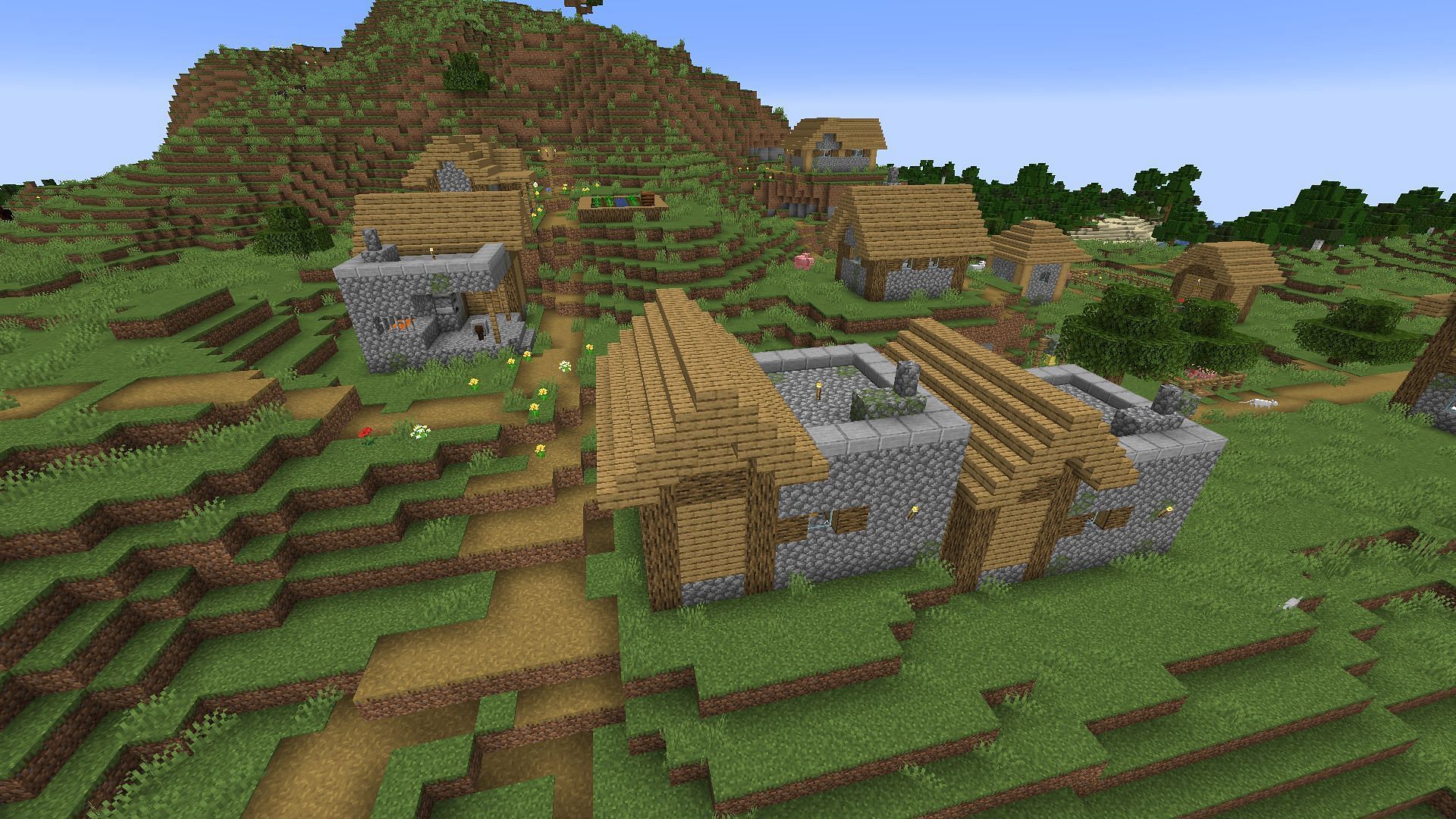 A village with two blacksmith houses (Image via Mojang &amp; Sportskeeda Gaming)