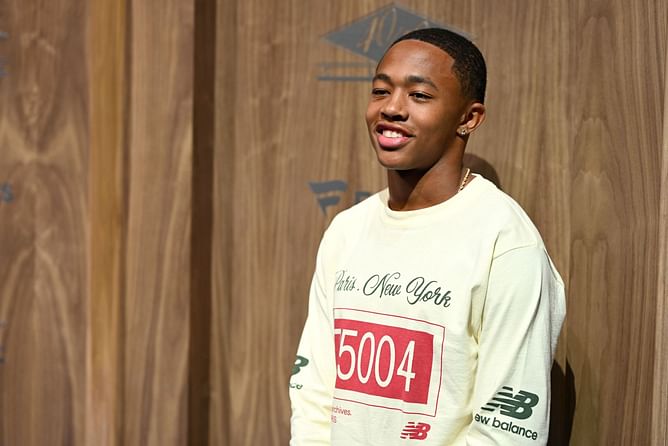 Quincy Wilson gets emotional as he gifts precious varsity jacket after double gold medal victory