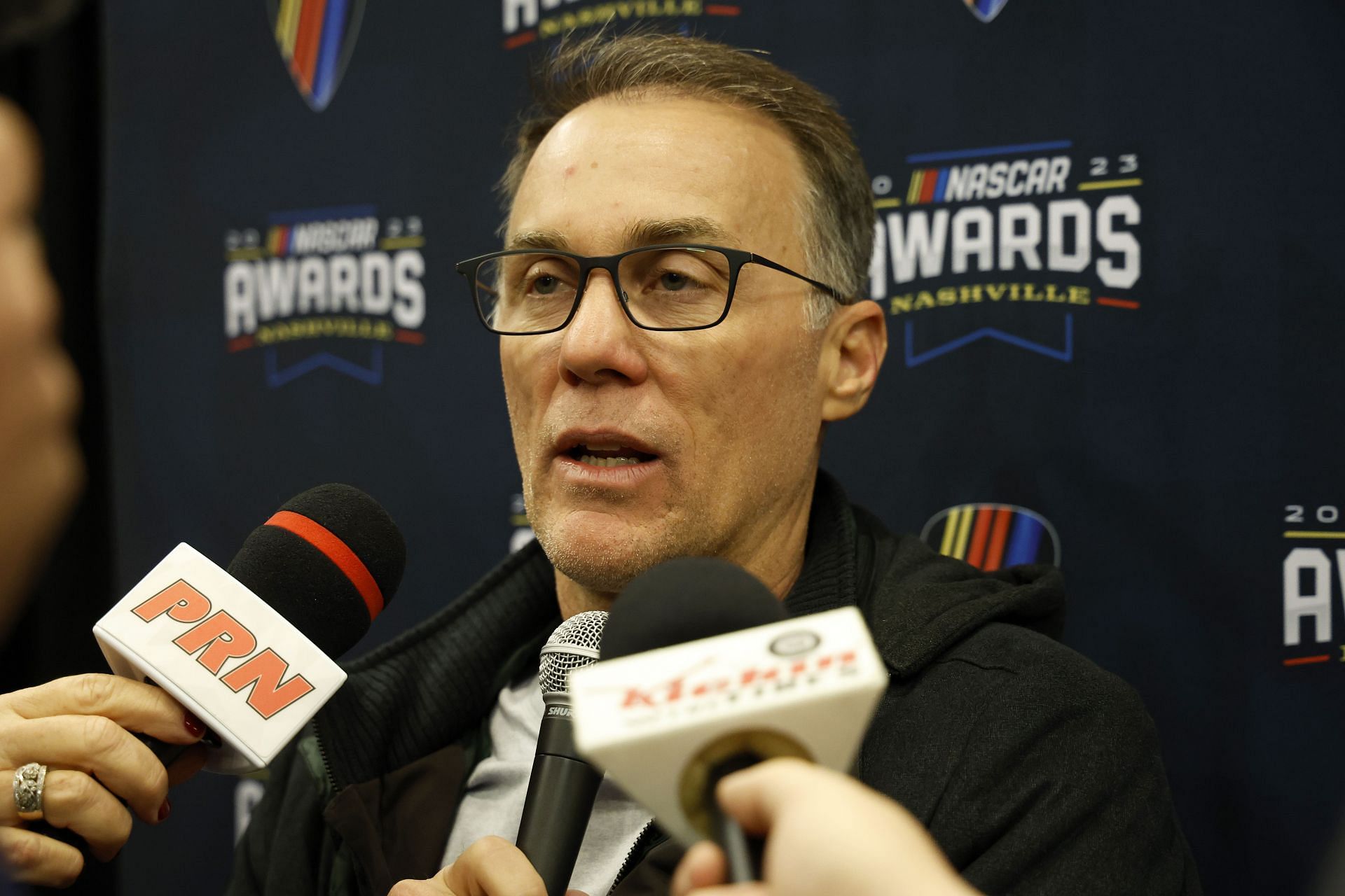  Kevin Harvick speaks to the media during the media scrum at Music City Center on November 30, 2023 in Nashville, Tennessee. - Source: Getty