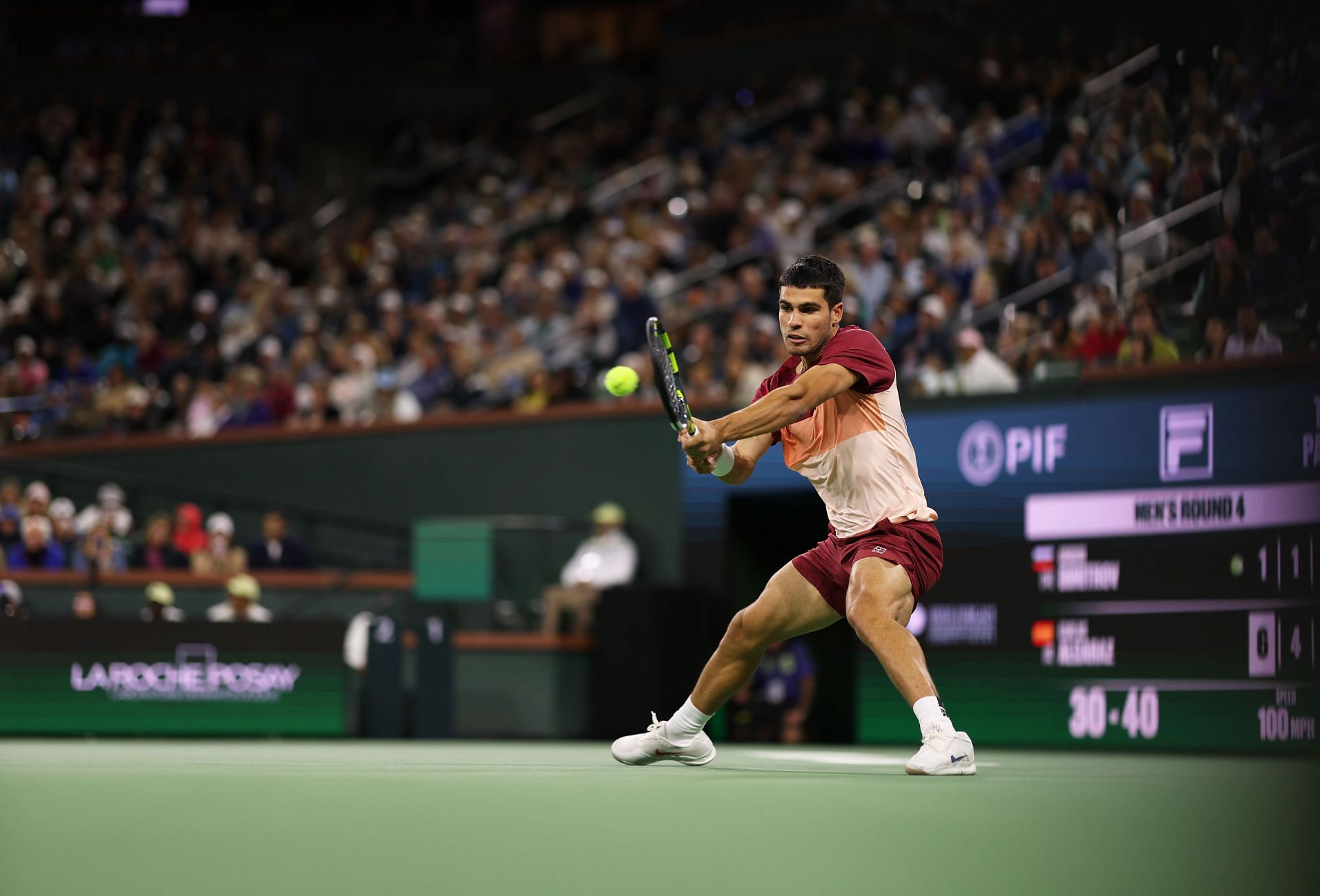 Carlos Alcaraz plays a backhand in the BNP Paribas Open - Source: Getty