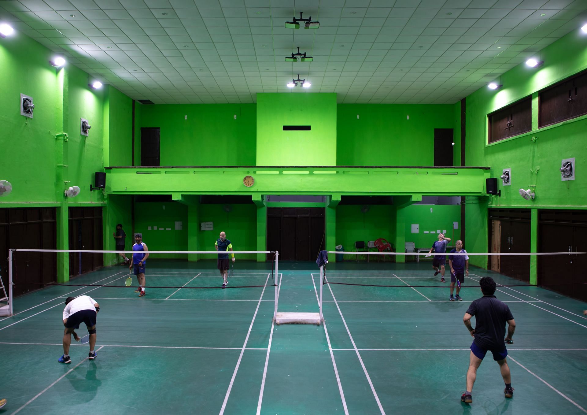 Men playing badminton in a former theatre inside model senior secondary school, Punjab State, Chandigarh, India... - Source: Getty