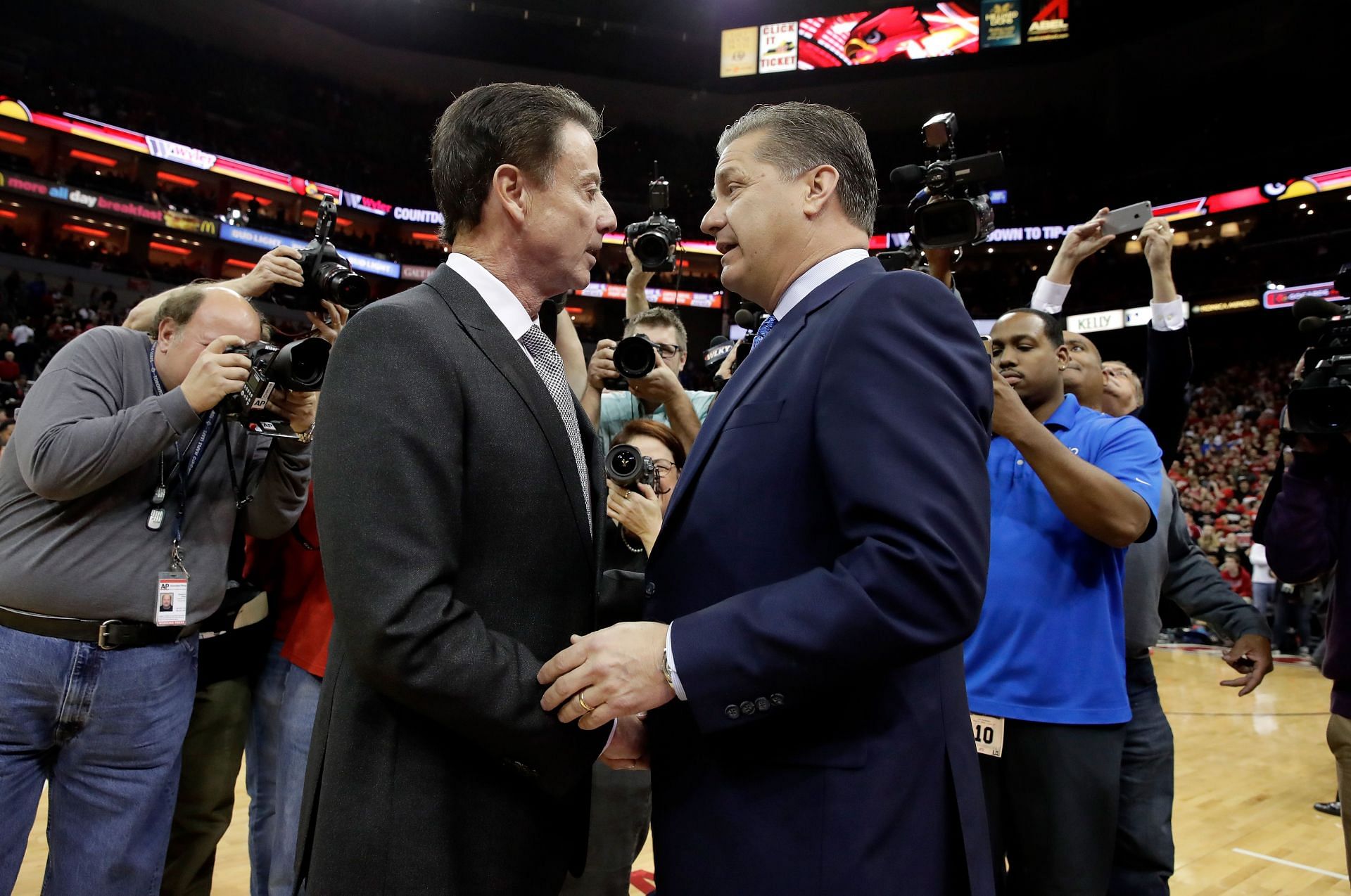 Rick Pitino and John Calipari talk before the Louisville Cardinals vs. Kentucky Wildcats game on December 21, 2016. Photo: Getty