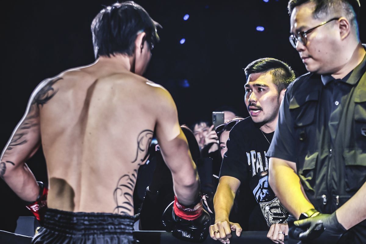 Prajanchai greeting Tawanchai following his TKO defeat at ONE 172. [Photo via: ONE Championship]