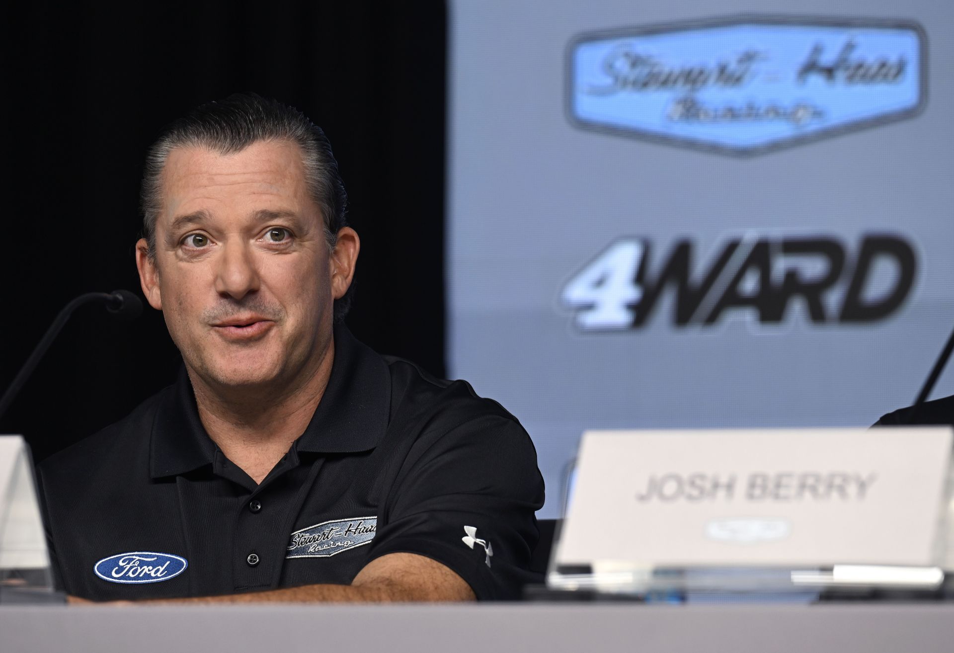 Tony Stewart talks with the media during a press conference  - Source: Getty