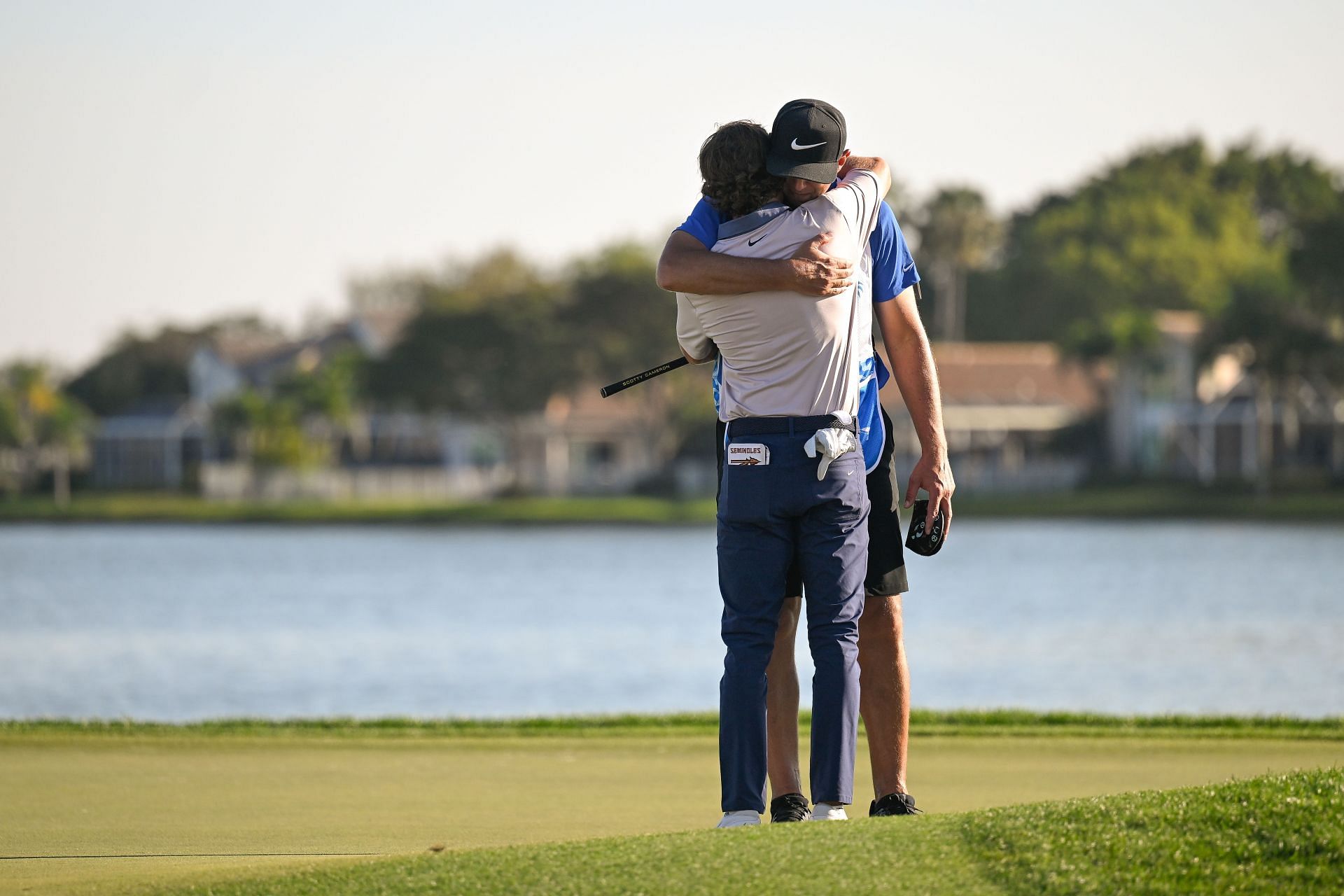 Clanton hugs his caddie after earning his PGA Tour card at the 2025 Cognizant Classic (via Getty)