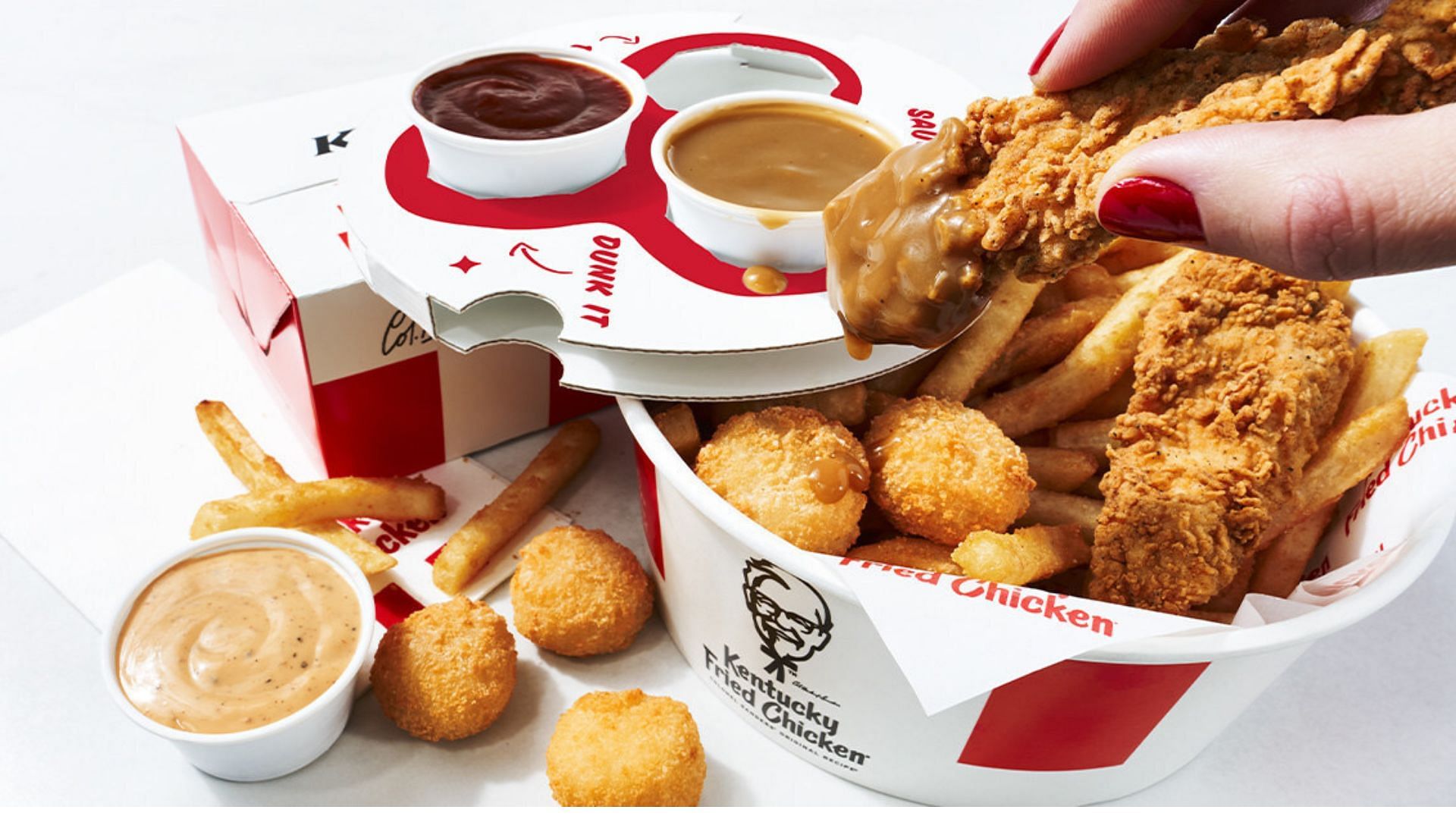 Sauce lovers rejoice: The new bucket includes seven dipping options (Image via KFC)