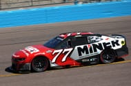 Carson Hocevar, driver of the #77 Miner Docks Doors and more Chevrolet, drives during practice for the NASCAR Cup Series Shriners Children's 500 at Phoenix Raceway on March 08, 2025 in Avondale, Arizona. - Source: Getty