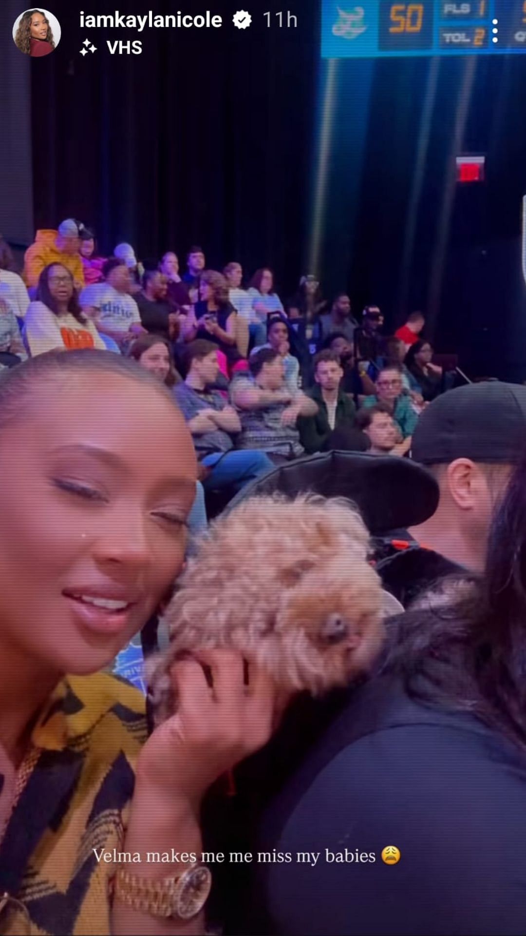 Nicole next to a dog at Lunar Owls vs Phantom (IG/iamkaylanicole)