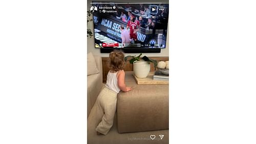 Kevin Love shares a pic of his daughter watching college basketball. Photo Credits: Kevin Love's IG account