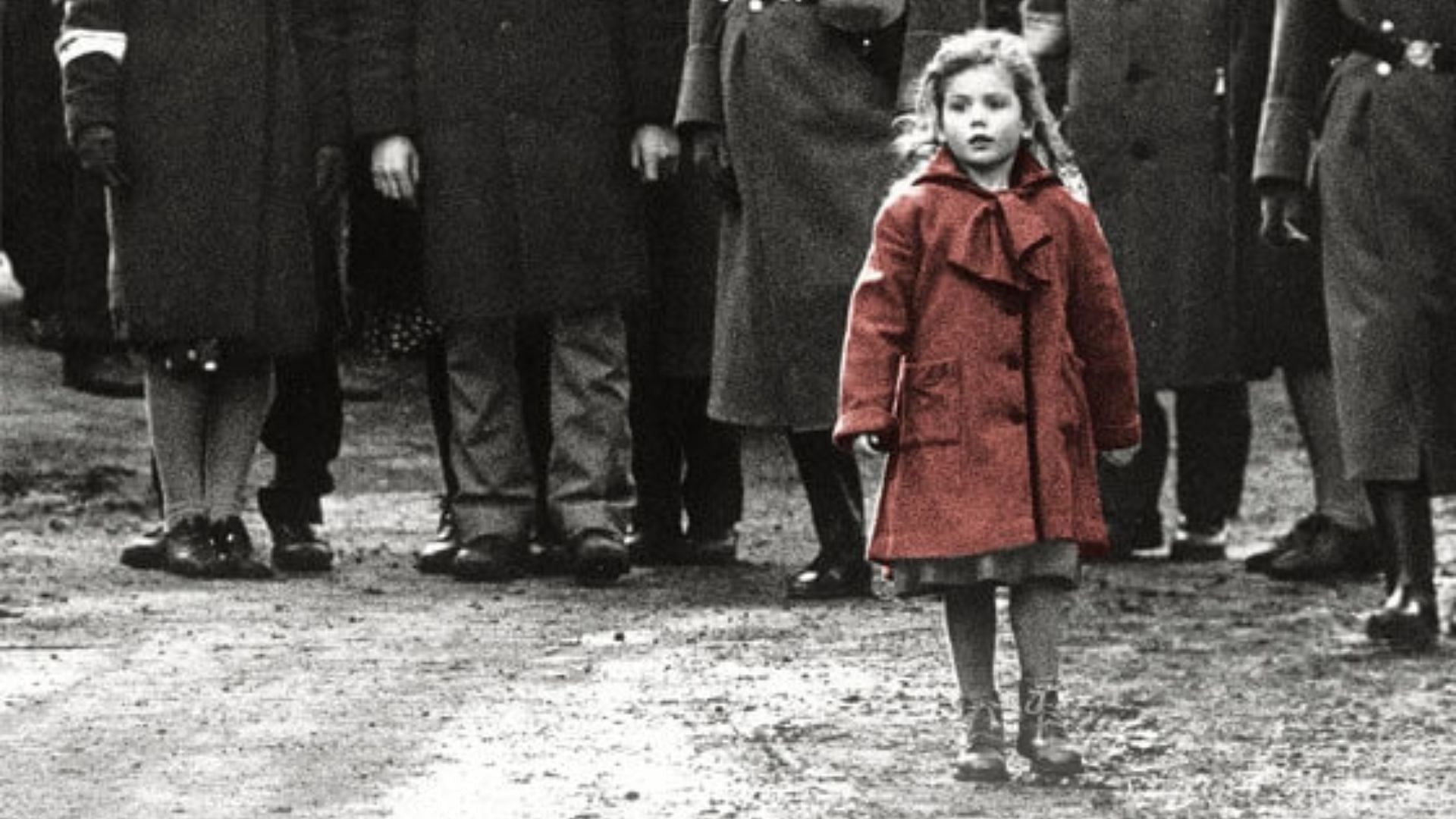 The girl in red – a symbol of innocence amidst horror (Image via Universal Pictures)