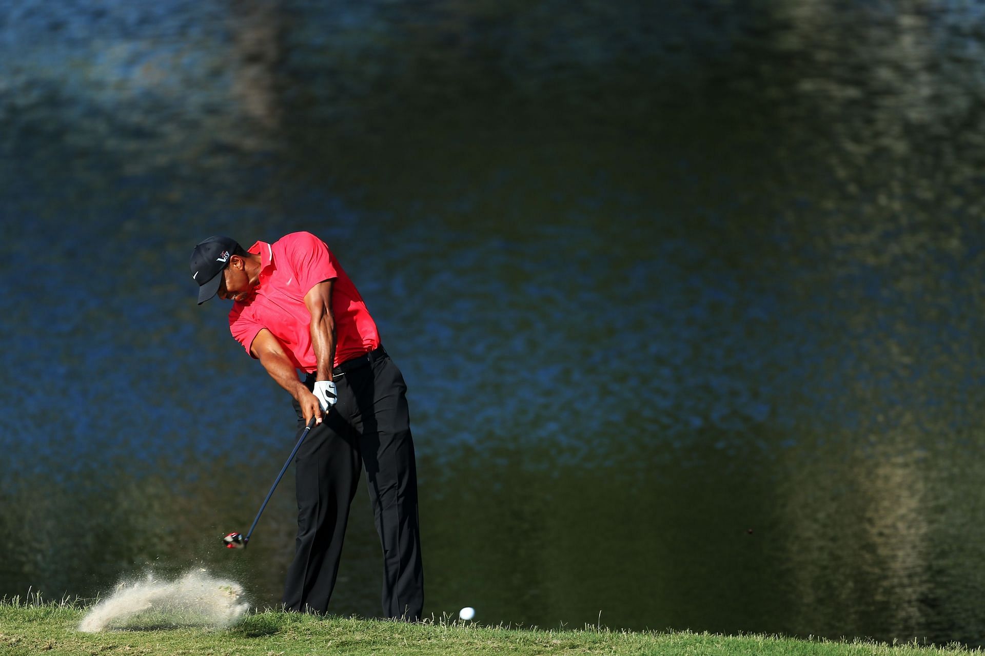 Tiger Woods plays his dropped ball on the 14th hole during the final round of The Players Championship at TPC Sawgrass on May 12, 2013 - Source: Getty