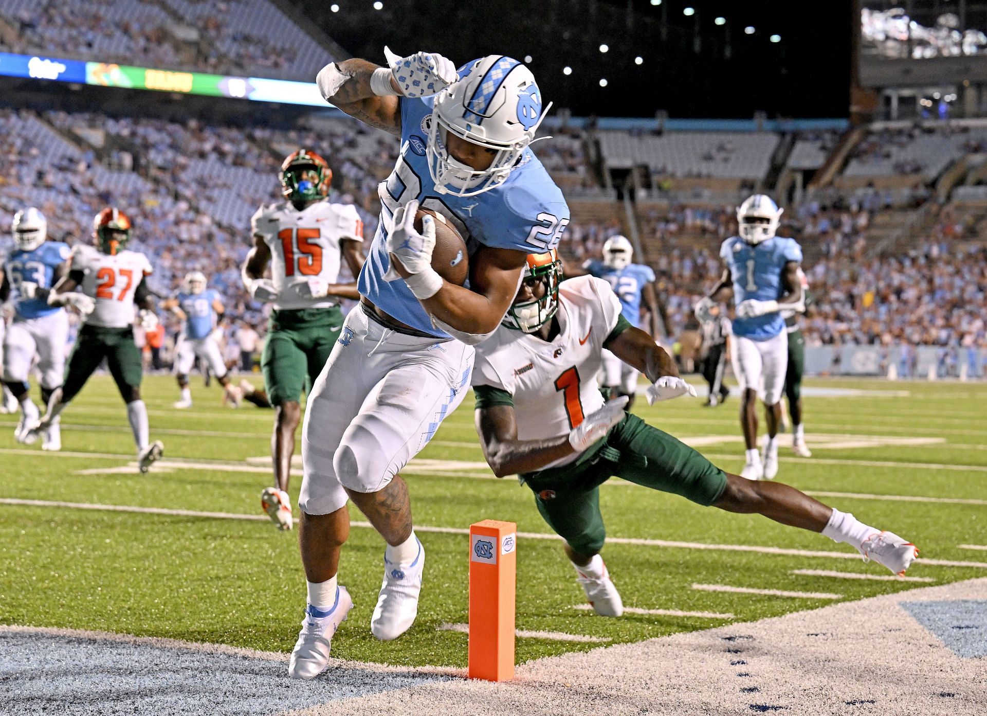 CHAPEL HILL, NORTH CAROLINA - AUGUST 27: Omarion Hampton #28 of the North Carolina Tar Heels scores against Lovie Jenkins #1 of the Florida A&amp;M Rattlers during the fourth quarter of their game at Kenan Memorial Stadium on August 27, 2022 in Chapel Hill, North Carolina. The Tar Heels won 56-24. (Photo by Grant Halverson/Getty Images) - Source: Getty