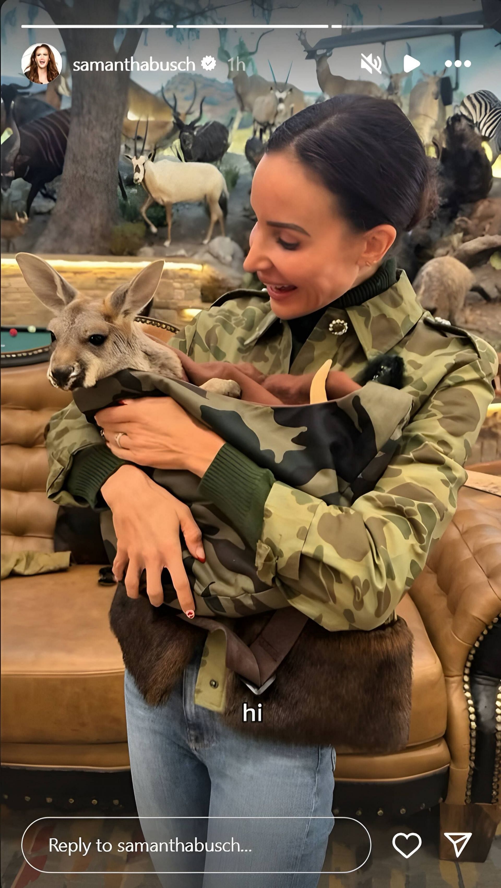 Samantha Busch carrying baby Kangaroo in a military print sling. Source: via Instagram, @samanthabusch