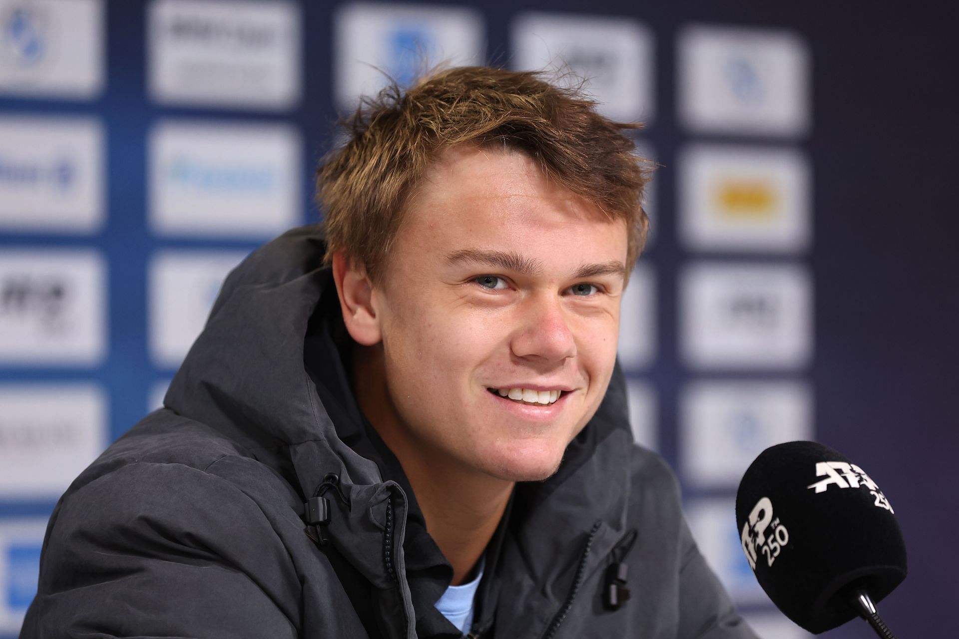 Holger Rune speaking at a press conference [Image Source: Getty Images]