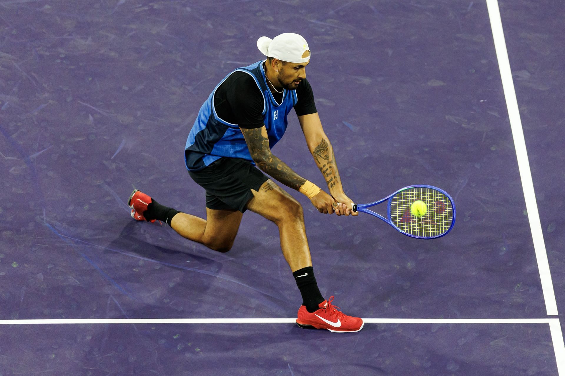 Kyrgios plays a backhand in the BNP Paribas Open - Source: Getty