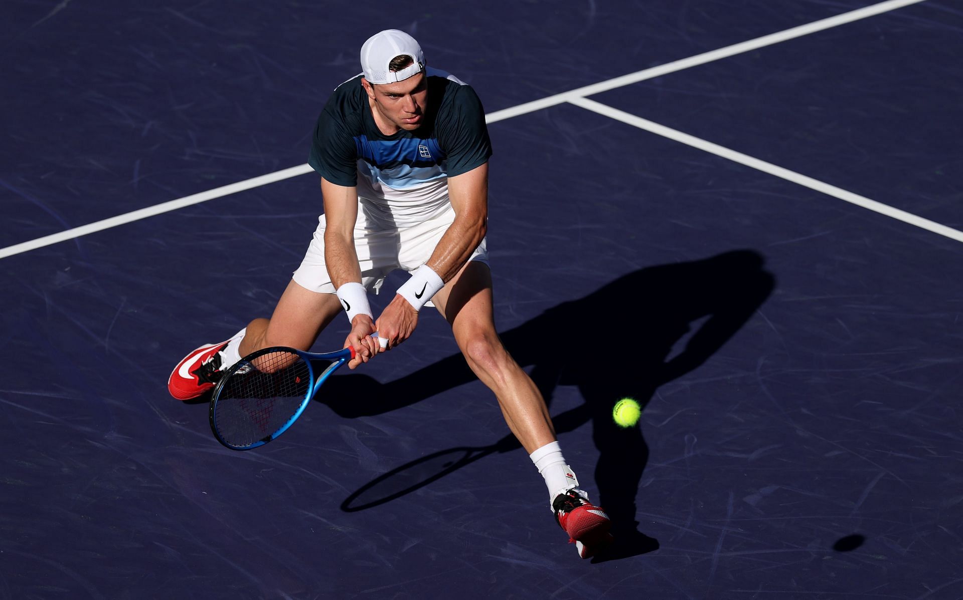 Draper plays a backhand in the BNP Paribas Open - Source: Getty