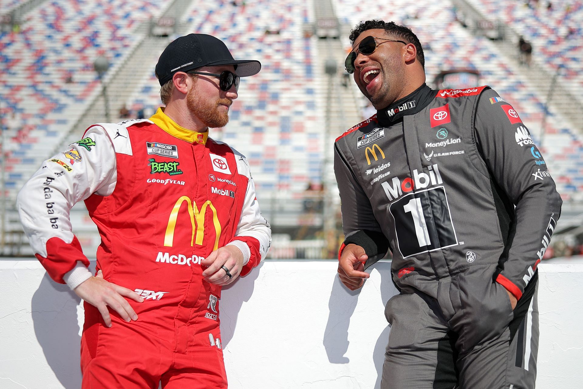 Bubba Wallace and Tyler Reddick share a laugh on the grid during practice for the NASCAR Bass Pro Shops Night Race at Bristol Motor Speedway on September 20, 2024 - Source: Getty