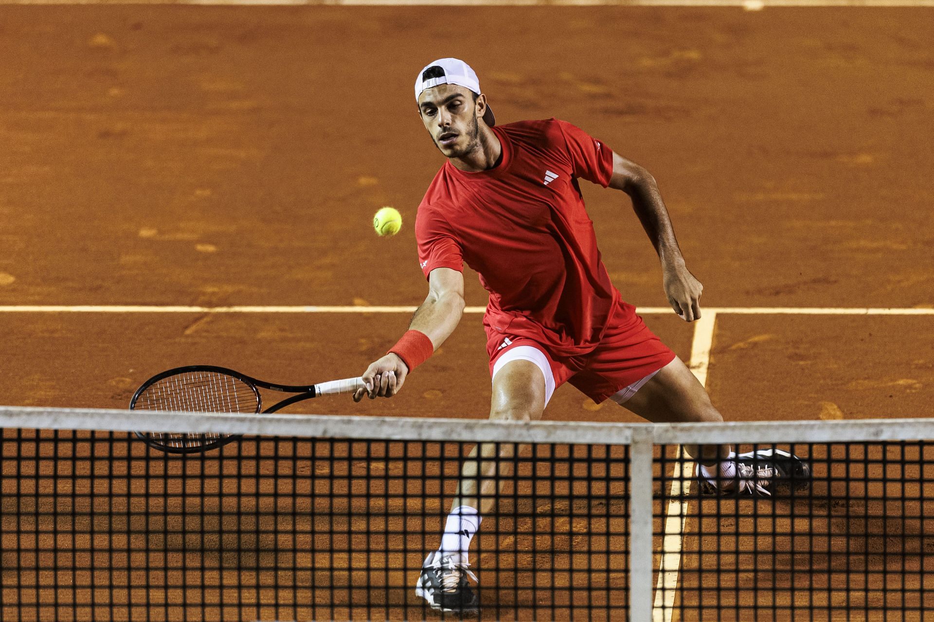 RIO DE JANEIRO, BRAZIL - FEBRUARY 20: Francisco Cerundolo of Argentina stretches to play the forehand against Luciano Darderi of Italy during day 4 of the Claro ATP 500 Rio Open 2025- Source: Getty