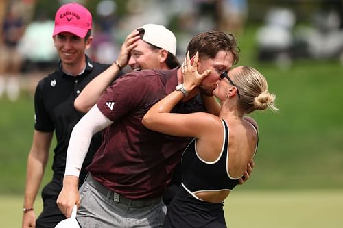 Richard Mansell celebrates with Ellie Mansell after winning the Porsche Singapore Classic 2025 (Image Source: Getty)