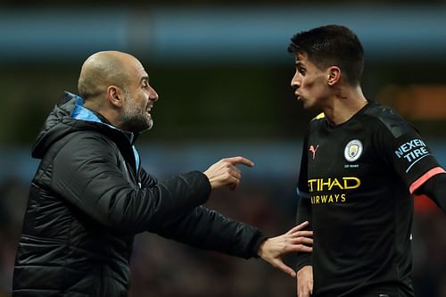 Pep Guardiola and Joao Cancelo (L to R) - Source: Getty