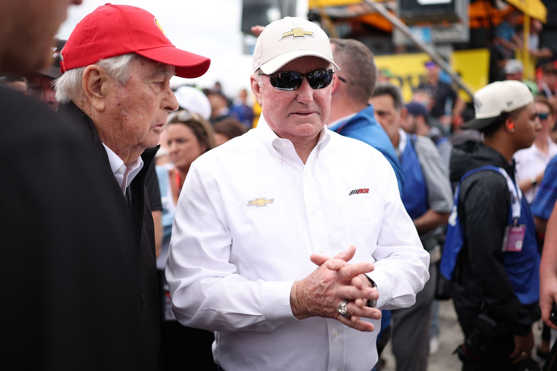 RCR team owner Richard Childress and Roger Penske, owner of the Penske Motorsports, talk on the grid prior to the 2025 Daytona 500 - Source: Getty