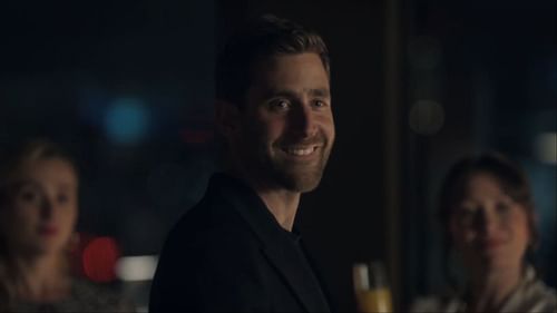 James Ellis, played by Oliver Jackson-Cohen, appears unexpectedly, leaving Sophie in disbelief at the Huntley engagement party (Image via AppleTV+)