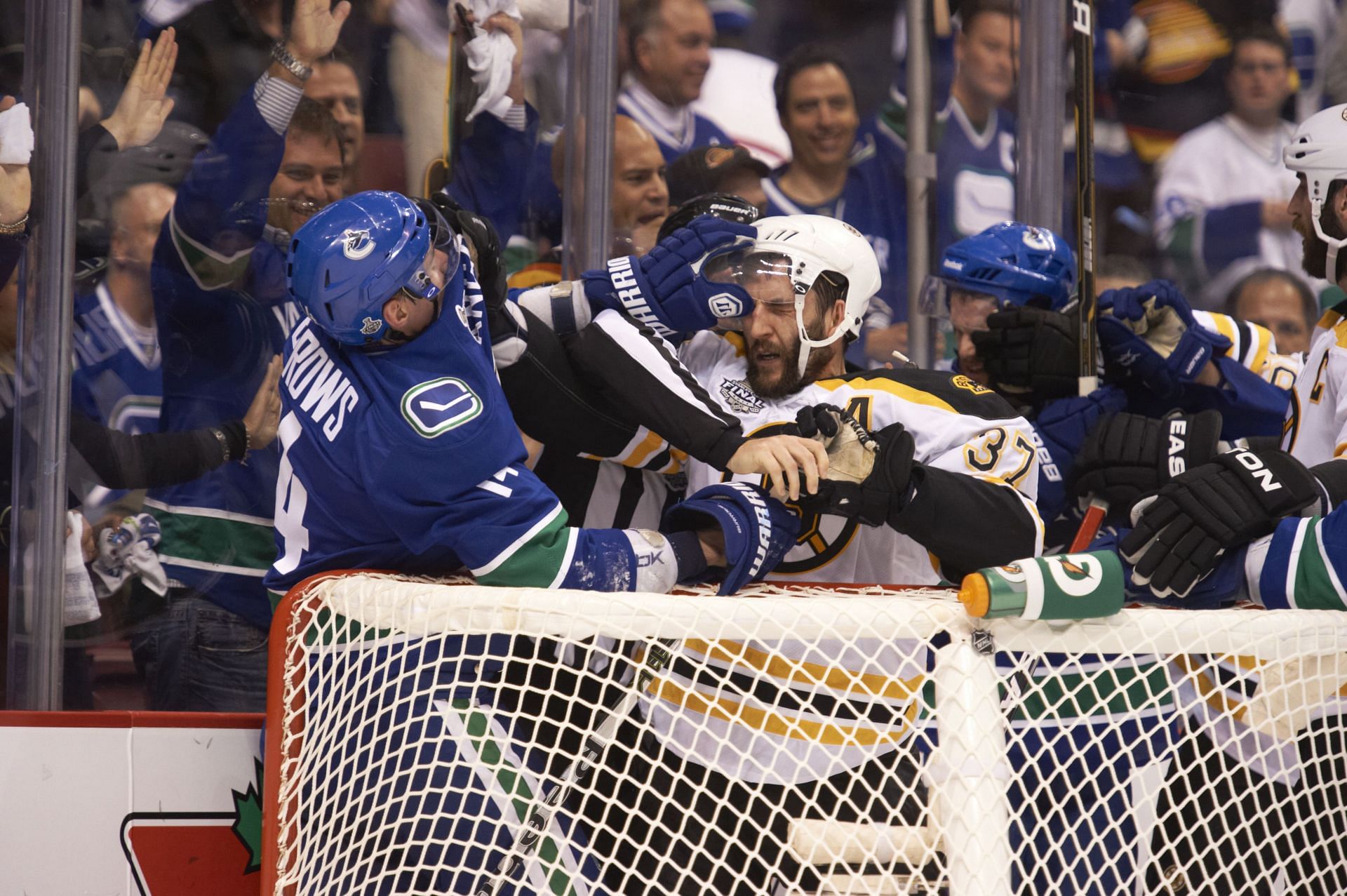 Vancouver Canucks Alexandre Burrows (14) and Boston Bruins Patrice Bergeron (37) during late first period scrum at Rogers Arena, Game 1 Stanley Cup FInals (Source: Getty Images)