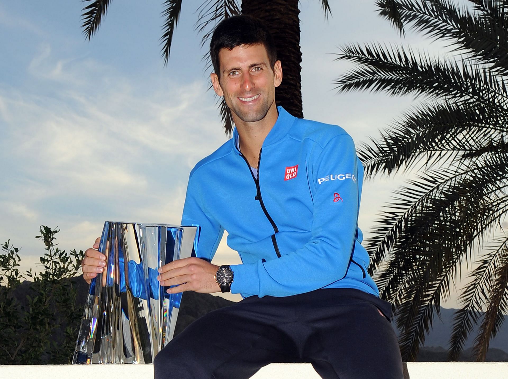 Novak Djokovic poses with the 2015 Indian Wells Masters title | Image Source: Getty