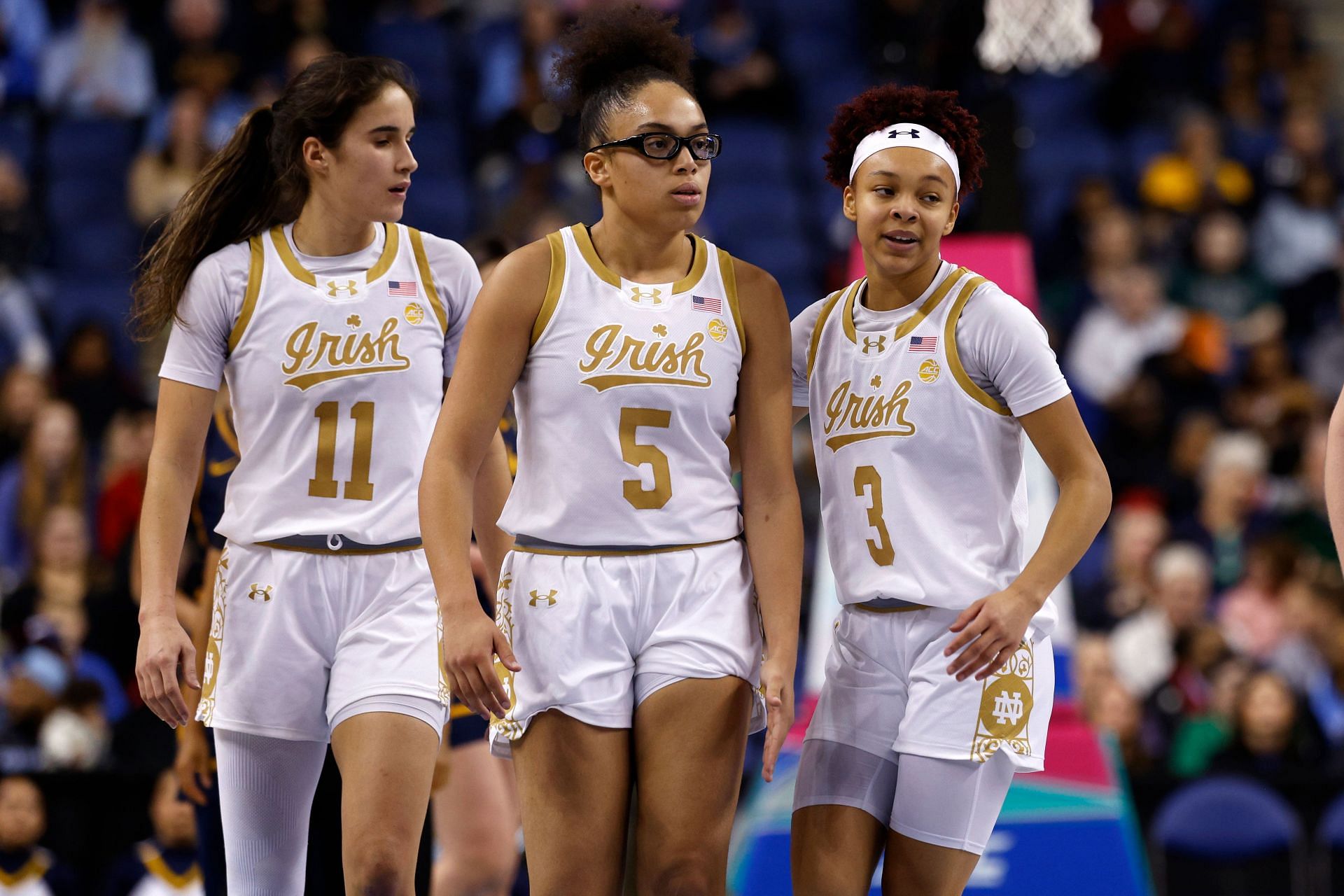 Sonia Citron (#11), Olivia Miles (#5) and Hannah Hidalgo (#3) of the Notre Dame Fighting Irish look on during their ACC Tournament quarterfinal game against the California Golden Bears at First Horizon Coliseum on March 7, 2025. Photo: Getty