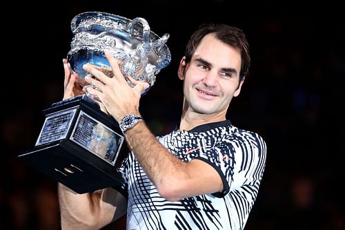 Roger Federer celebrating with the 2017 Australian Open men's singles trophy (Source: Getty)