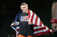 Hendrickson with the National flag during the 2025 NCAA Wrestling Championships (Image via: Getty Images)