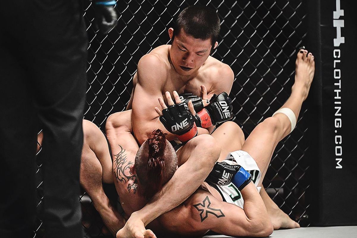 Shinya Aoki hunting for a submission victory. [Photo via: ONE Championship]